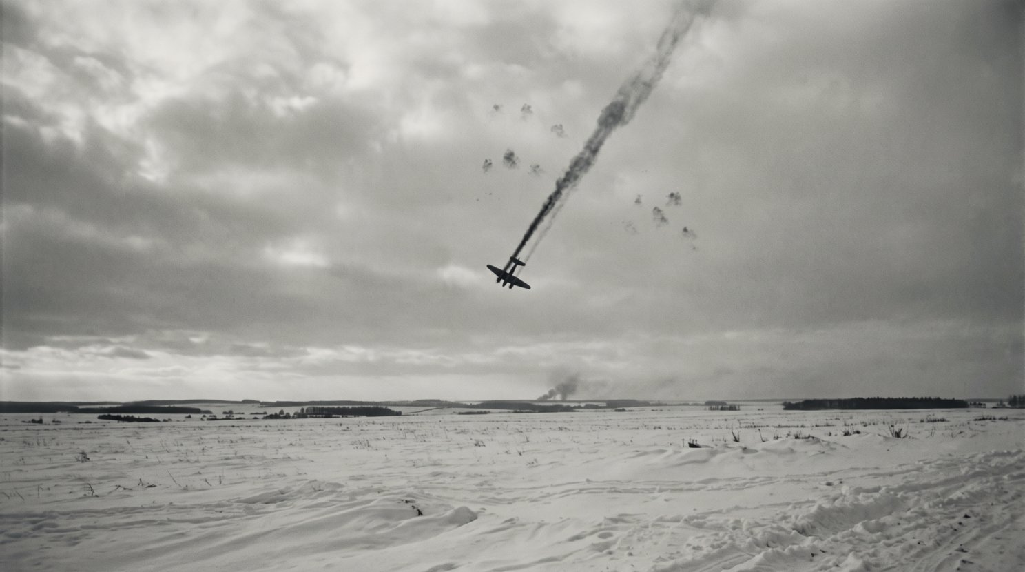 A plane shot down over a winter landscape
